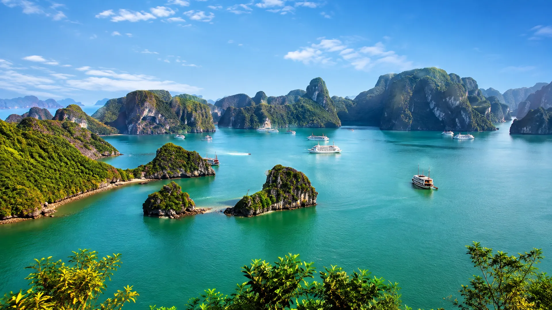 Vietnam bay with limestone islands and traditional boats